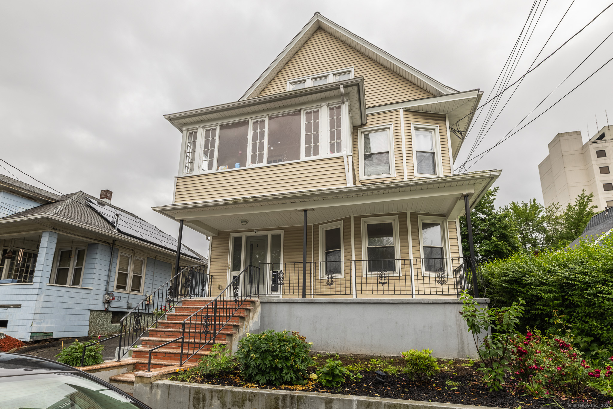 25 Hunting Street Bridgeport, CT 06606 - Photo 2 of 26 a front view of a house with a yard
