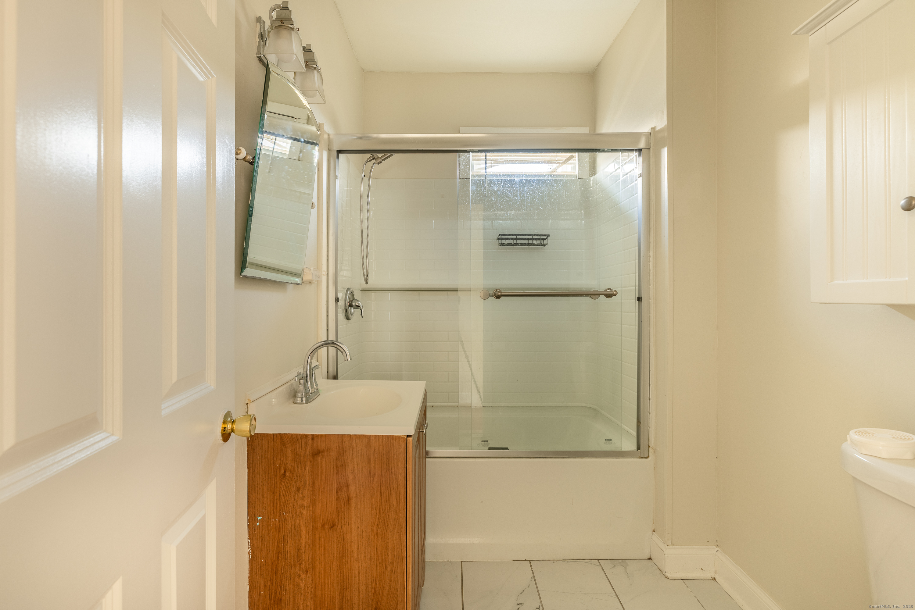 25 Hunting Street Bridgeport, CT 06606 - Photo 22 of 26 a bathroom with a shower and a sink