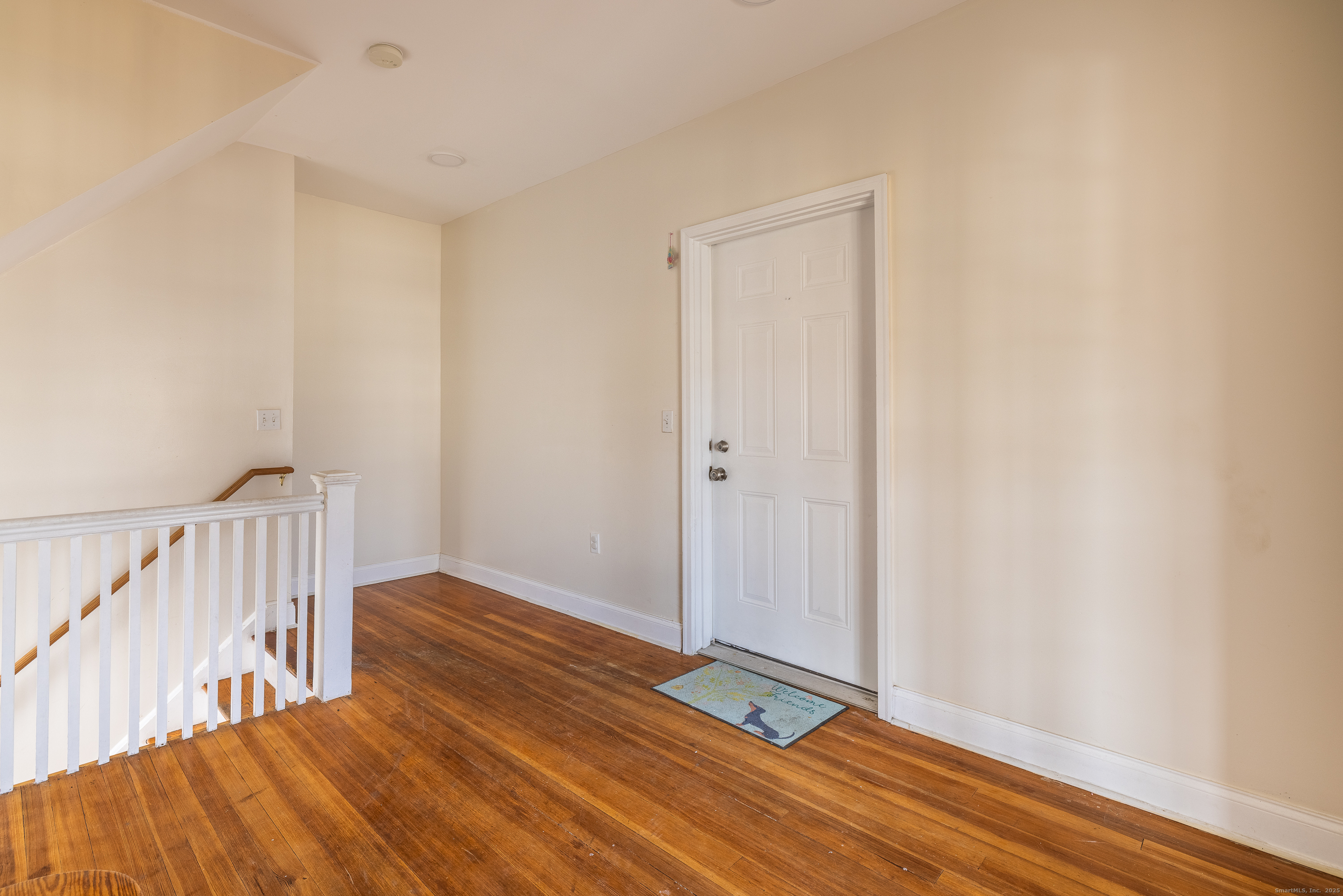 25 Hunting Street Bridgeport, CT 06606 - Photo 5 of 26 a view of a room with wooden floor and white walls