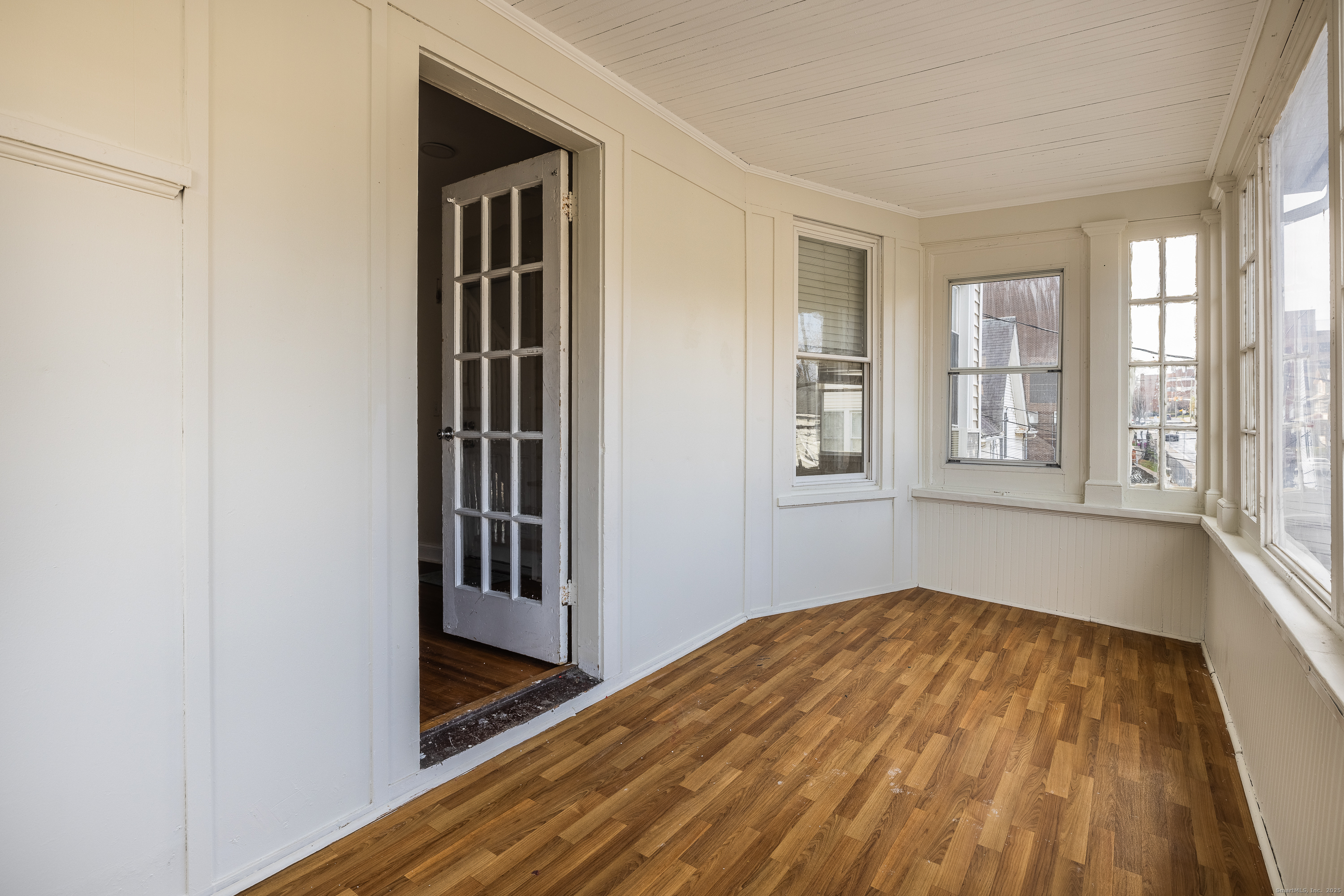 25 Hunting Street Bridgeport, CT 06606 - Photo 7 of 26 a view of a big room with wooden floor and windows