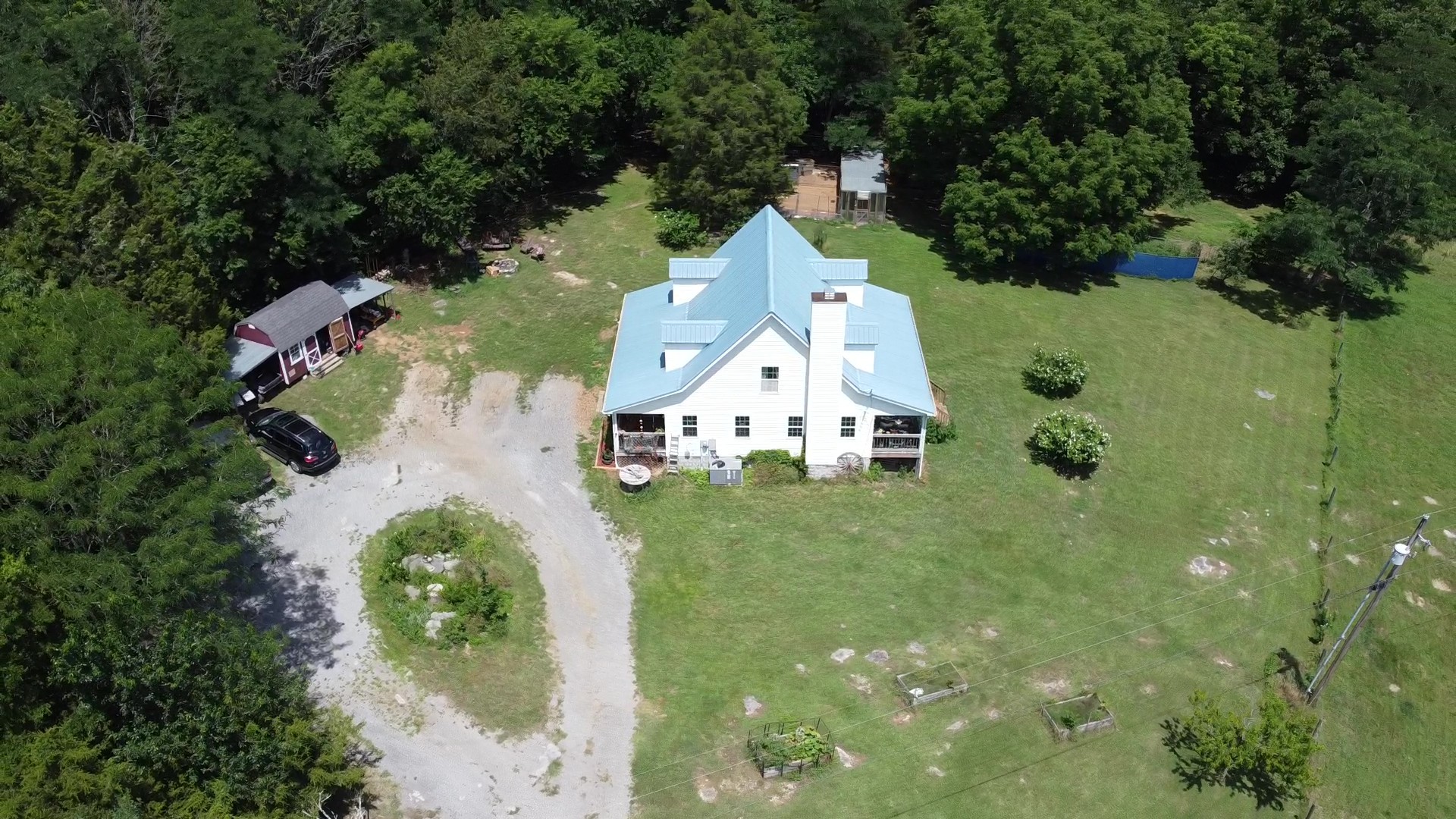 2770 Beech Log Road Watertown, TN 37184 - Photo 86 of 87 an aerial view of a house with a yard and trees all around