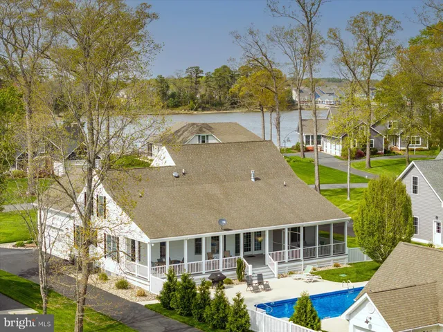 a aerial view of a house with a swimming pool