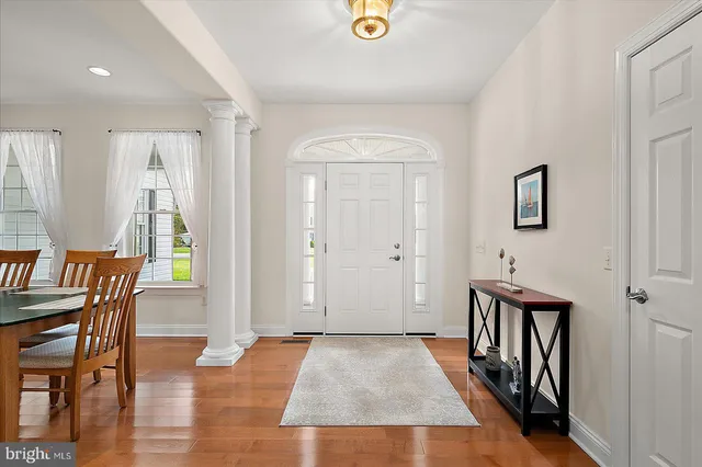 a bathroom with a sink a toilet a bathtub a mirror and shower