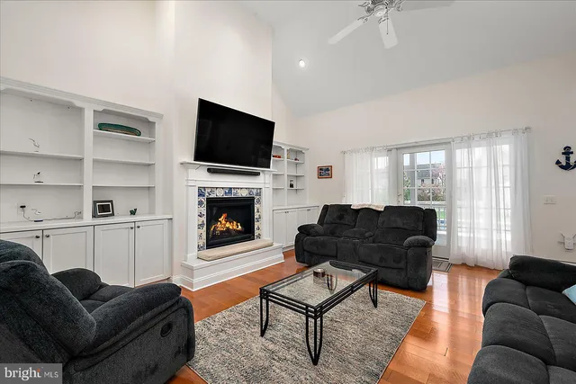 a spacious bedroom with two beds and a chandelier