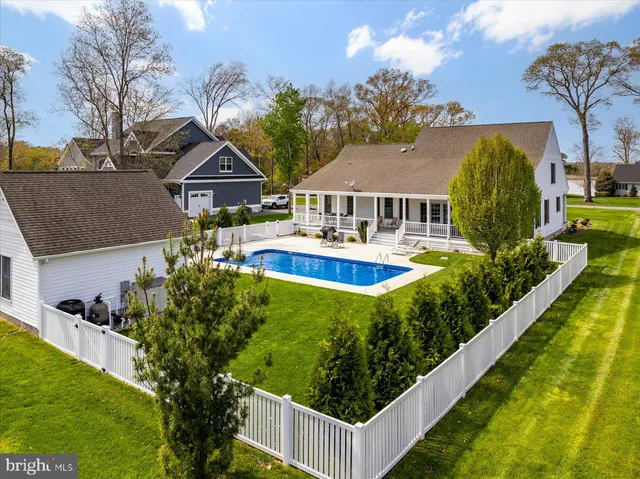 a view of a livingroom with furniture and a table chair