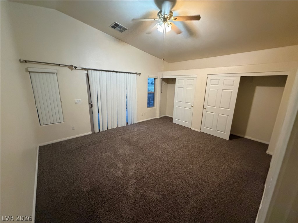 7629 Rory Court Las Vegas, NV 89129 - Photo 7 of 25 A spacious bedroom offers ample natural light and convenient closet access.