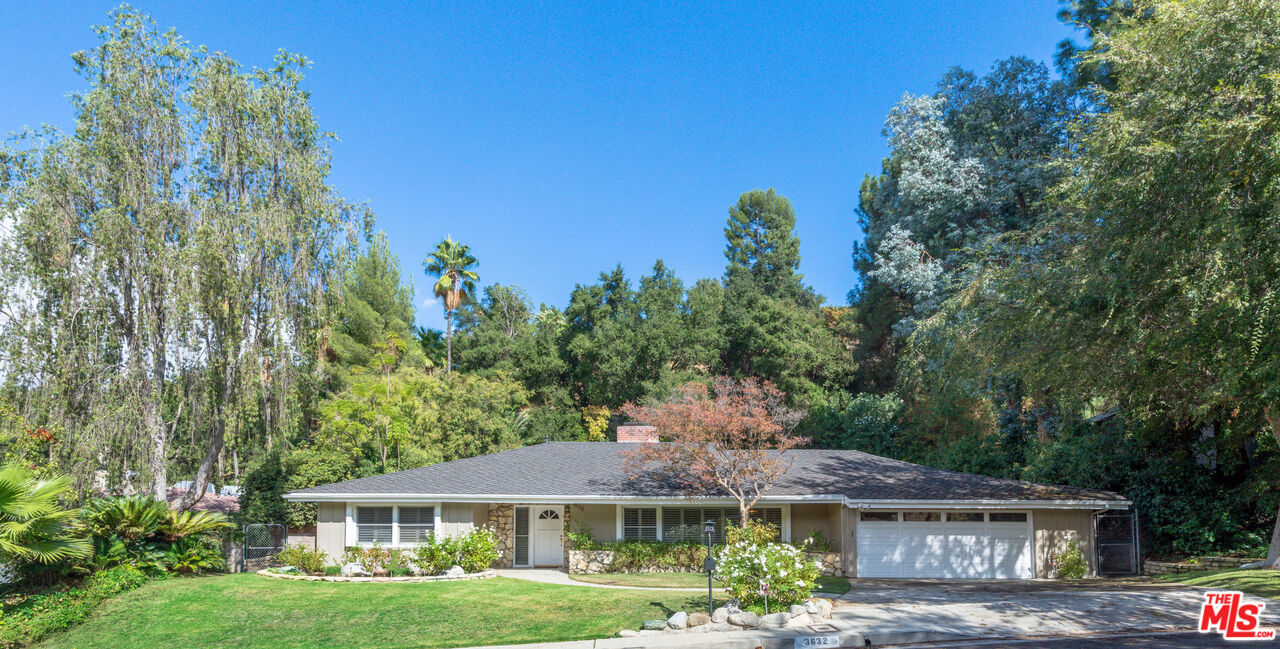 3632 Valley Meadow Road Sherman Oaks, CA 91403 - Photo 1 of 18 a front view of a house with a yard and potted plants