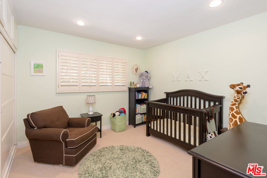 3632 Valley Meadow Road Sherman Oaks, CA 91403 - Photo 13 of 18 a bedroom with furniture and a window