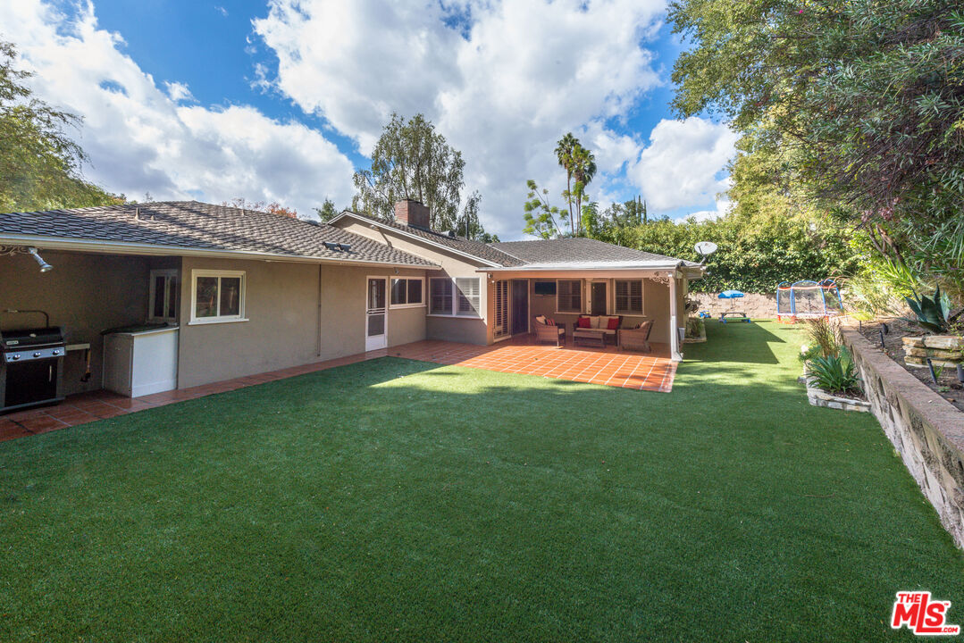 3632 Valley Meadow Road Sherman Oaks, CA 91403 - Photo 17 of 18 a view of a house with a backyard