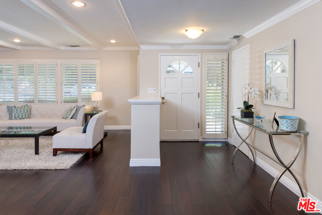 3632 Valley Meadow Road Sherman Oaks, CA 91403 - Photo 4 of 18 a living room with furniture and wooden floor