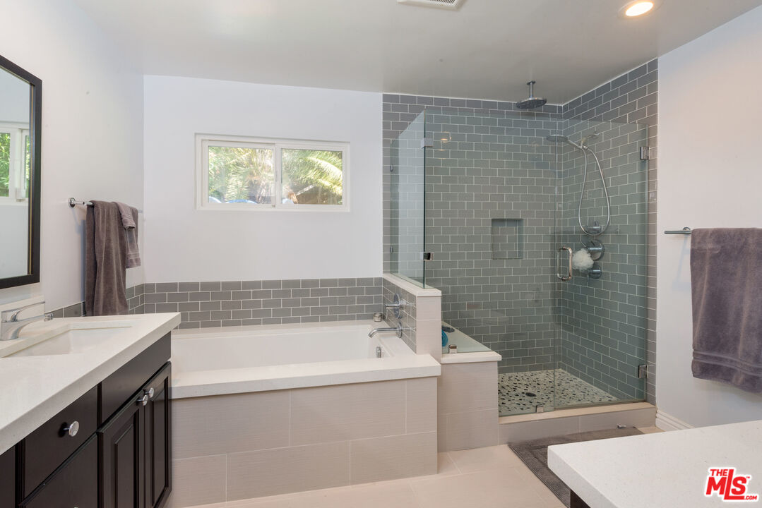 3632 Valley Meadow Road Sherman Oaks, CA 91403 - Photo 10 of 18 a bathroom with a bathtub and a sink