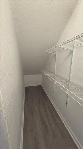a view of an empty walk in closet