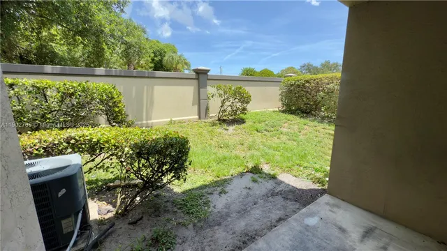 a view of a backyard of the house