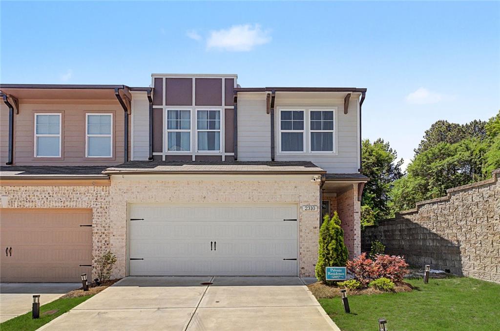 2310 Portrush Way Southeast Atlanta, GA 30339 - Photo 1 of 38 front view of house with a yard