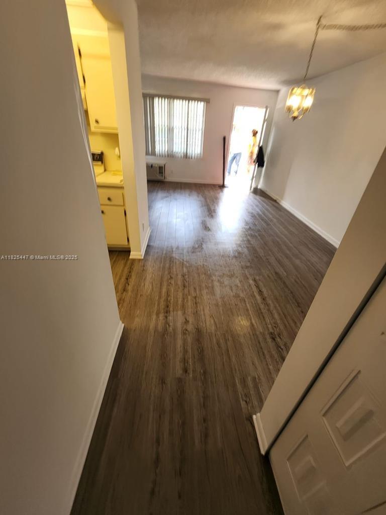 151 Southwest 134th Way, Unit 212N Pembroke Pines, FL 33027 - Photo 12 of 19 a view of a living room with a hardwood floor