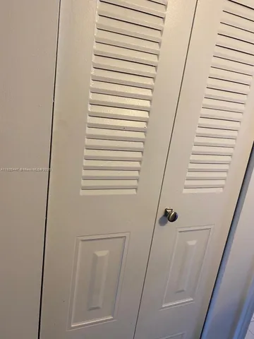 a bathroom with a toilet sink and shower