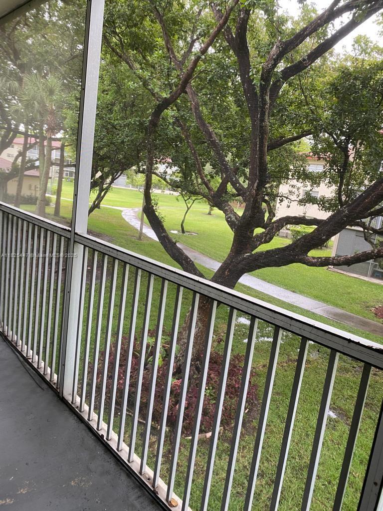 151 Southwest 134th Way, Unit 212N Pembroke Pines, FL 33027 - Photo 18 of 19 a view of outdoor space and deck
