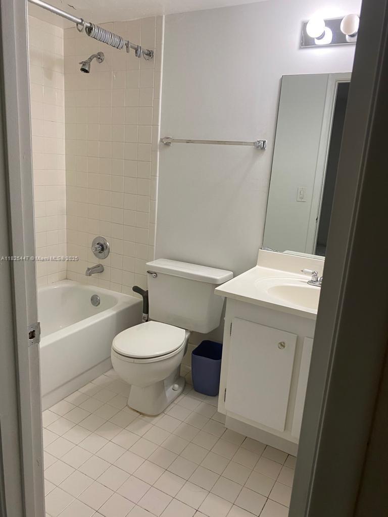 151 Southwest 134th Way, Unit 212N Pembroke Pines, FL 33027 - Photo 19 of 19 a bathroom with a toilet sink and shower
