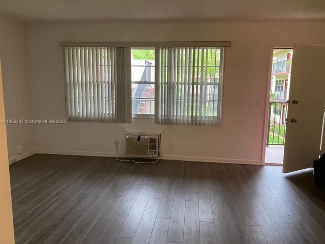 a view of a living room with a hardwood floor