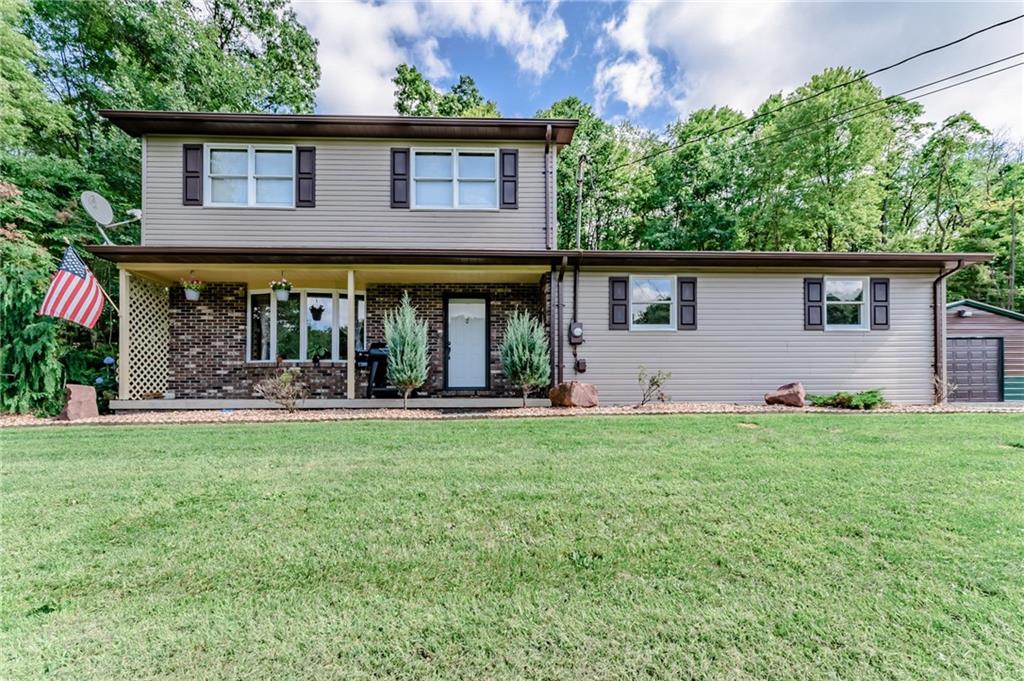 front view of a house with a yard