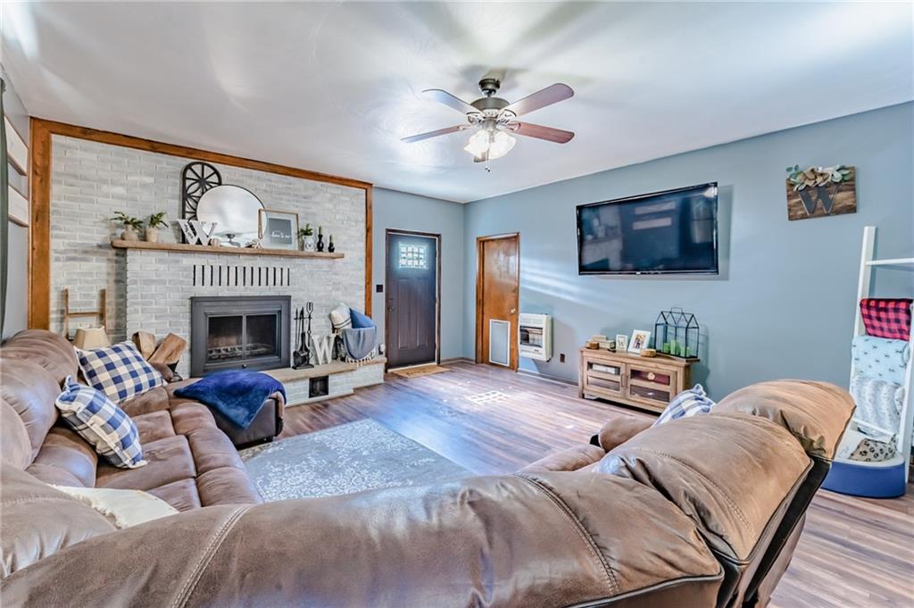 708 Margaret Road Kittanning, PA 16201 - Photo 11 of 25 a living room with furniture a fireplace and a flat screen tv