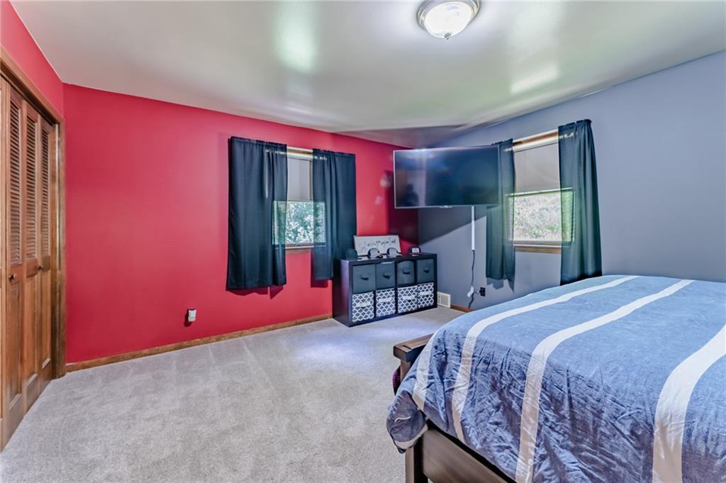 708 Margaret Road Kittanning, PA 16201 - Photo 13 of 25 a bed room with a bed and a window