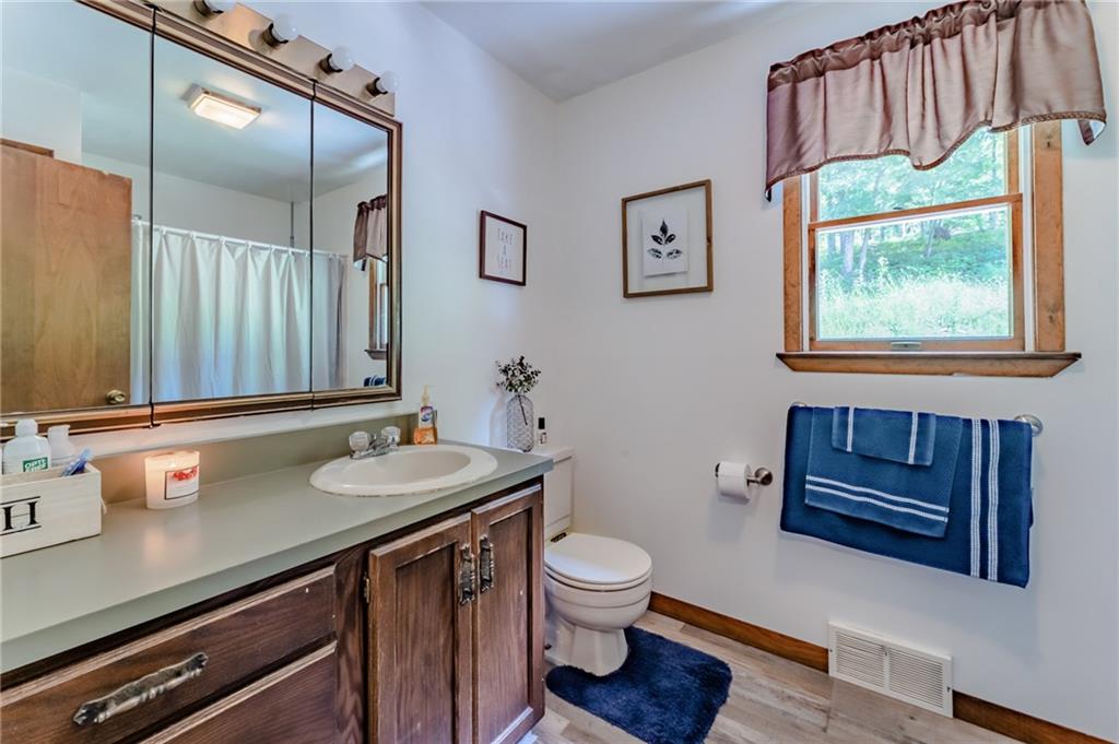 708 Margaret Road Kittanning, PA 16201 - Photo 21 of 25 a bathroom with a sink a toilet and a large mirror
