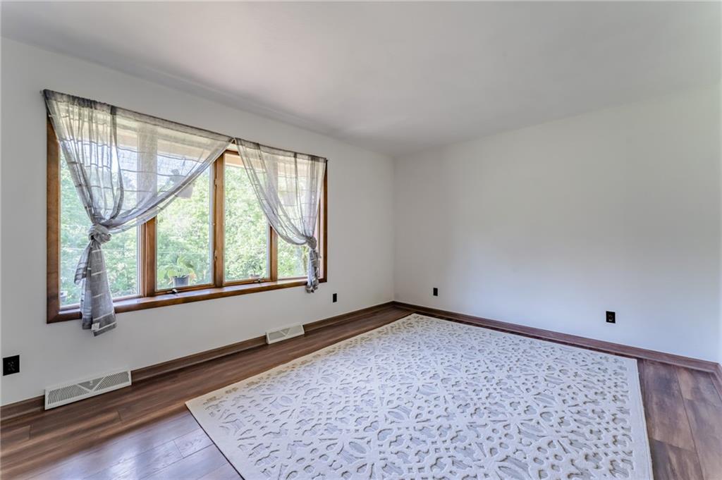 708 Margaret Road Kittanning, PA 16201 - Photo 4 of 25 wooden floor in an empty room with a window