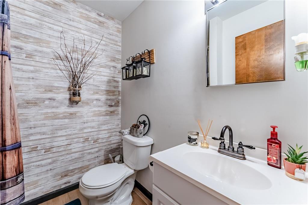 708 Margaret Road Kittanning, PA 16201 - Photo 9 of 25 a bathroom with a toilet sink and mirror