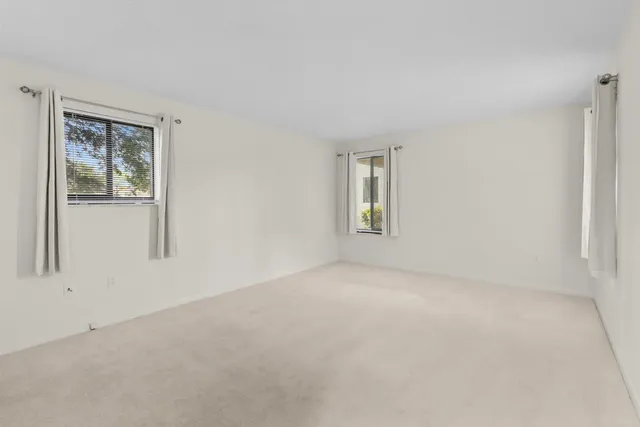 a view of an empty room and closet area