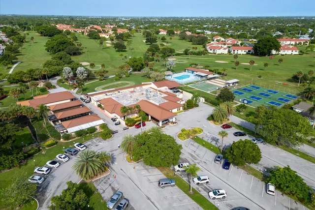 an aerial view of a pool patio patio and outdoor kitchen