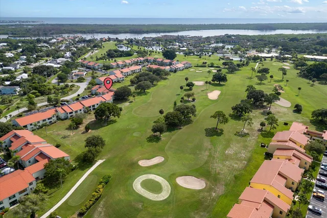an aerial view of a houses with a lake view