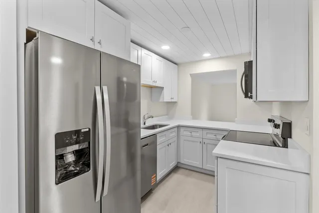 a kitchen with a sink and cabinets