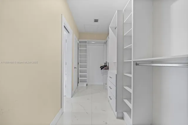 a room with furniture pool table and window