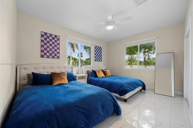 a bedroom with a bed and a mirror