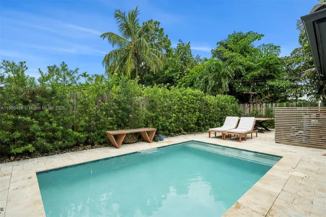 a backyard of a house with yard and seating space
