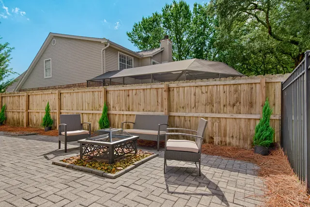 a view of a house with backyard and garden