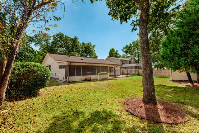 a bathroom with a double vanity sink toilet and a mirror