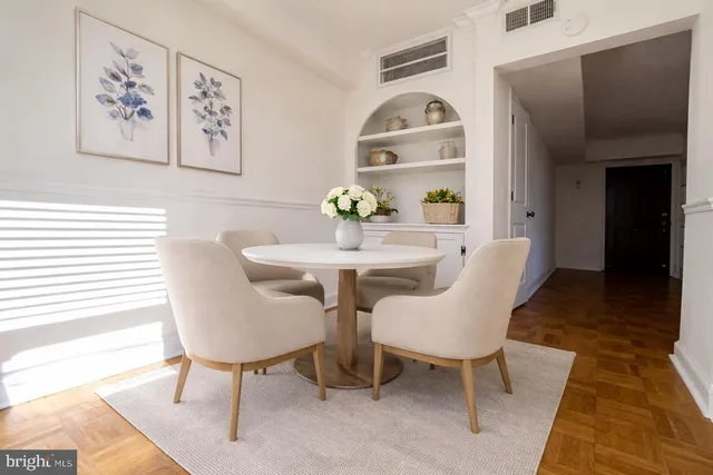 a view of a dining room with furniture and wooden floor