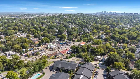 an aerial view of a city with lots of residential buildings