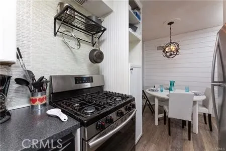 a stove top oven sitting inside of a kitchen