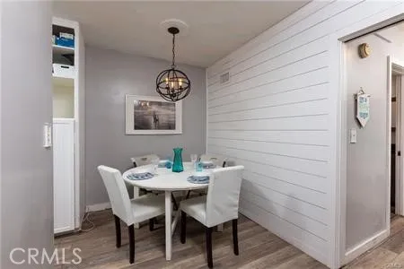a view of a dining room that has a table and chairs