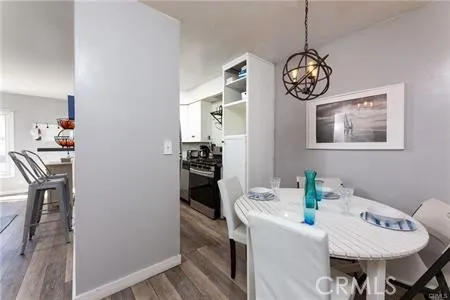 a view of a dining area with furniture and chandelier