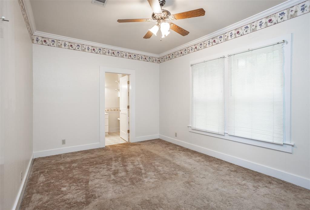 206 Ritchey Street Gainesville, TX 76240 - Photo 18 of 36 a view of an empty room with a window