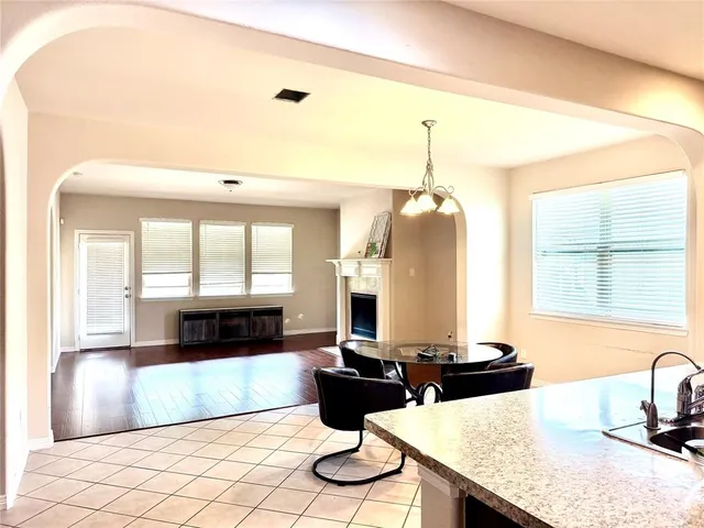 a kitchen with a table and chairs