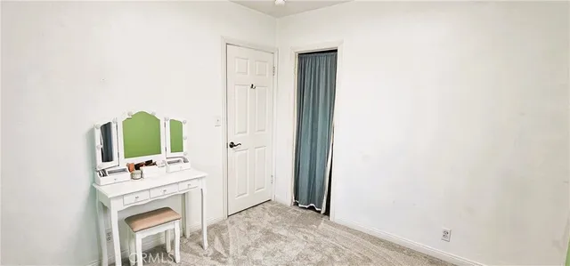 a bathroom with a sink vanity and mirror