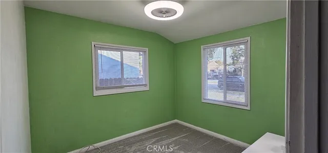 a view of a room that has a window in it