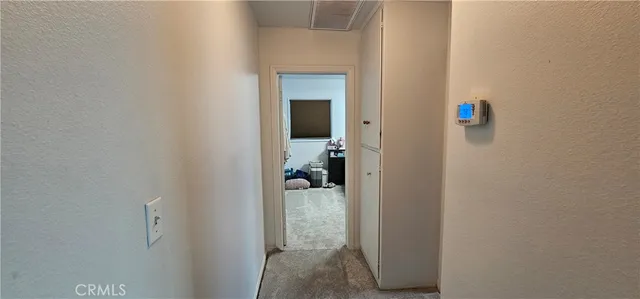 a bedroom with a bed and flat screen tv