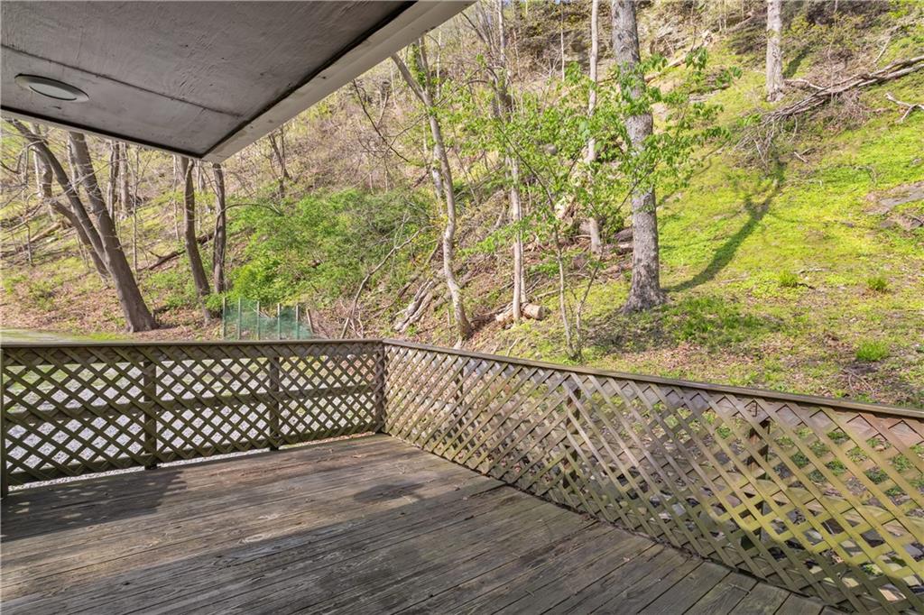1360 Abers Creek Road Monroeville, PA 15146 - Photo 13 of 37 a view of wooden floor with a trees in the background