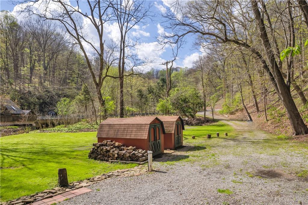 1360 Abers Creek Road Monroeville, PA 15146 - Photo 7 of 37 a backyard of a house with yard and trampoline